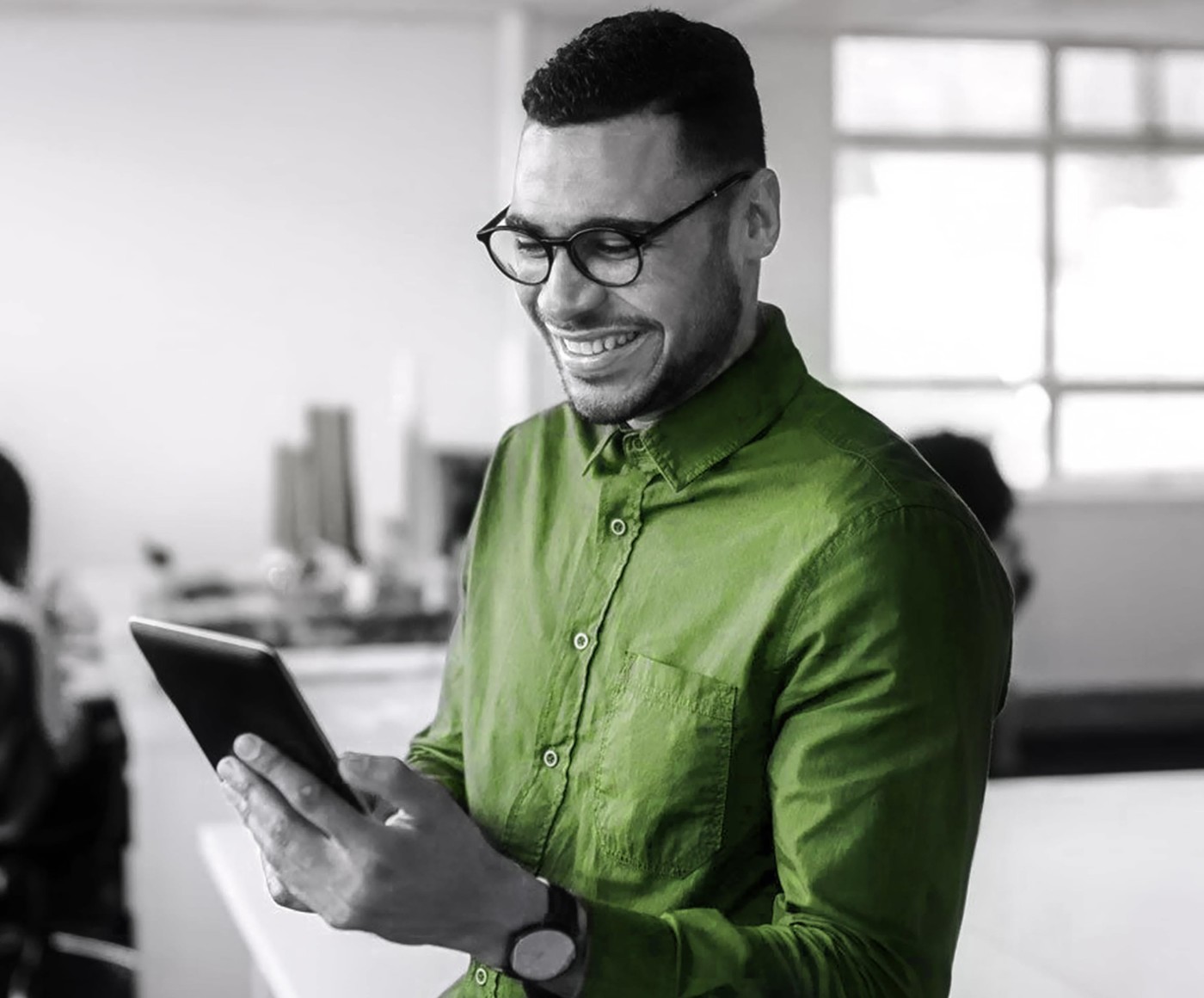 man tracking order on tablet